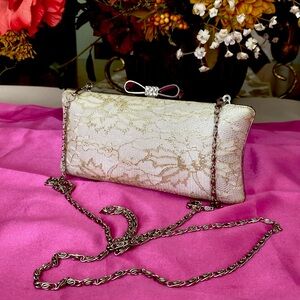 Evening ivory and gold lace with silver metal frame,